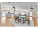 Open dining area with hardwood floors and kitchen views at 942 N Miramar --, Mesa, AZ 85213