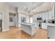 Bright kitchen features white cabinets and a large island at 942 N Miramar --, Mesa, AZ 85213