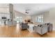 Open living space with hardwood floors and a brick fireplace at 942 N Miramar --, Mesa, AZ 85213