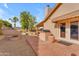 Brick patio features an outdoor fire pit and built-in grill, near the pool at 942 N Miramar --, Mesa, AZ 85213