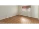 Bright bedroom with ample natural light and laminate flooring at 10214 E Michigan Ave, Sun Lakes, AZ 85248
