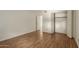 Bedroom with wood laminate flooring and a large closet at 10214 E Michigan Ave, Sun Lakes, AZ 85248