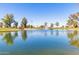 Tranquil lake view with a central fountain at 10214 E Michigan Ave, Sun Lakes, AZ 85248