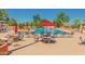 Inviting pool area with lounge chairs and umbrellas at 10214 E Michigan Ave, Sun Lakes, AZ 85248