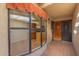 Bright entryway with bay window and wooden door at 10214 E Michigan Ave, Sun Lakes, AZ 85248