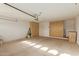 Attached garage with ample storage cabinets at 10214 E Michigan Ave, Sun Lakes, AZ 85248