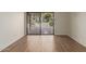 Gathering room with sliding glass doors and view of backyard at 10214 E Michigan Ave, Sun Lakes, AZ 85248