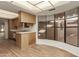 Galley kitchen with wood cabinets and laminate floors at 10214 E Michigan Ave, Sun Lakes, AZ 85248