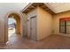 Private tiled patio with gated entry and storage area at 10214 E Michigan Ave, Sun Lakes, AZ 85248