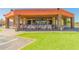 Spacious outdoor patio with multiple tables and chairs, perfect for relaxing or entertaining at 10214 E Michigan Ave, Sun Lakes, AZ 85248