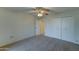 Bedroom with ceiling fan and double door closet at 10225 N 105Th Dr, Sun City, AZ 85351
