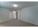 Spacious bedroom with double door closet and carpet flooring at 10225 N 105Th Dr, Sun City, AZ 85351