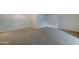 Spacious living room with neutral carpeting at 10225 N 105Th Dr, Sun City, AZ 85351
