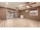 Bright Gathering room featuring tile floors and sliding glass doors leading to the backyard at 11211 N 37Th Dr, Phoenix, AZ 85029