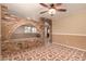 Open living area with brick archway and tile floor at 11211 N 37Th Dr, Phoenix, AZ 85029