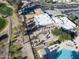 Aerial view of community clubhouse, tennis courts, and pool at 11642 S Half Moon Dr, Phoenix, AZ 85044