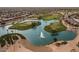 Aerial view of a community with a golf course and lake at 12903 W Copperstone Dr, Sun City West, AZ 85375