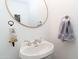 Clean bathroom with updated vanity and a large mirror at 13968 N 96Th St, Scottsdale, AZ 85260