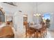 Bright dining room with wood table and chairs, offering views to backyard at 16010 E El Lago Blvd, Fountain Hills, AZ 85268