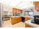 Kitchen with wood cabinets, and a view from the window at 16010 E El Lago Blvd, Fountain Hills, AZ 85268