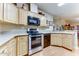 Well-equipped kitchen with stainless steel appliances and ample counter space at 17200 W Bell Rd # 91, Surprise, AZ 85374