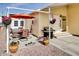 Covered patio with seating area, grill, and hanging planters at 17200 W Bell Rd # 91, Surprise, AZ 85374