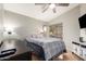 Bedroom with queen-size bed and ceiling fan at 19522 N 84Th Ave, Peoria, AZ 85382