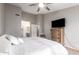 King-size bed, ceiling fan, and walk-in closet at 19522 N 84Th Ave, Peoria, AZ 85382