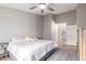 King-size bed, ceiling fan, and access to the bathroom at 19522 N 84Th Ave, Peoria, AZ 85382