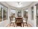 Bright breakfast nook with a round table and chairs, overlooking the backyard at 19522 N 84Th Ave, Peoria, AZ 85382