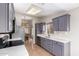Modern kitchen with stainless steel appliances and light gray cabinets at 19522 N 84Th Ave, Peoria, AZ 85382
