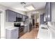 Modern kitchen with stainless steel appliances and light gray cabinets at 19522 N 84Th Ave, Peoria, AZ 85382