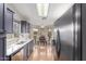 Modern kitchen with gray cabinets, a breakfast nook, and ample counter space at 19522 N 84Th Ave, Peoria, AZ 85382