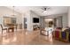 Open-concept living and dining area with a ceiling fan and access to the patio at 19522 N 84Th Ave, Peoria, AZ 85382