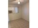 Bright bedroom featuring tile floors and a ceiling fan at 2150 W Missouri Ave # 121, Phoenix, AZ 85015