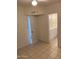 Bedroom with adjacent bathroom and tile floors at 2150 W Missouri Ave # 121, Phoenix, AZ 85015