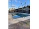 Community pool with surrounding apartments visible at 2150 W Missouri Ave # 121, Phoenix, AZ 85015
