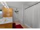 Main bathroom with a double vanity and shower/tub combo at 250 Cottonwood Ln, Wickenburg, AZ 85390