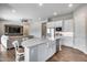 Spacious kitchen with island, stainless steel appliances, and white cabinetry at 26741 N 74Th Ave, Peoria, AZ 85383