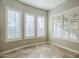 Bright breakfast nook with tile floors and plantation shutters at 4353 E Santa Fe Ct, Gilbert, AZ 85297