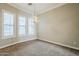 Elegant dining room with chandelier and plantation shutters at 4353 E Santa Fe Ct, Gilbert, AZ 85297