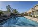 Relaxing pool with waterfall feature and spacious backyard at 4353 E Santa Fe Ct, Gilbert, AZ 85297