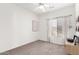 Simple bedroom with window, ceiling fan, and record player at 5353 W Mercury Pl, Chandler, AZ 85226