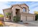 Two-story house with a three-car garage and desert landscaping at 5353 W Mercury Pl, Chandler, AZ 85226