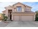 Two-story house with a three-car garage and desert landscaping at 5353 W Mercury Pl, Chandler, AZ 85226