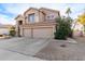 Two-story house with a three-car garage and desert landscaping at 5353 W Mercury Pl, Chandler, AZ 85226