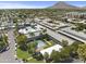 Aerial view of apartment community with pool, parking, and surrounding cityscape at 6834 E 4Th St # 7, Scottsdale, AZ 85251