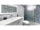 Updated bathroom with a modern vanity, mosaic tile, and a frameless glass shower at 6834 E 4Th St # 7, Scottsdale, AZ 85251