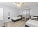 Bedroom with two twin beds, light gray walls, and ample natural light at 6834 E 4Th St # 7, Scottsdale, AZ 85251