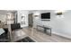 Open living room with a view of kitchen and backyard at 6834 E 4Th St # 7, Scottsdale, AZ 85251